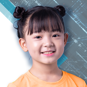 young child with bangs and space buns wearing a yellow shirt